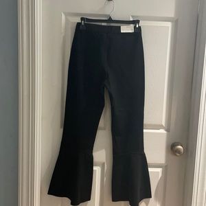 Black flare fitted flat front pant. Very slimming pant. Polyester/spandex